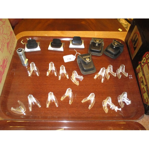 216 - Zippo Lighter Stands, Leather Pouches etc