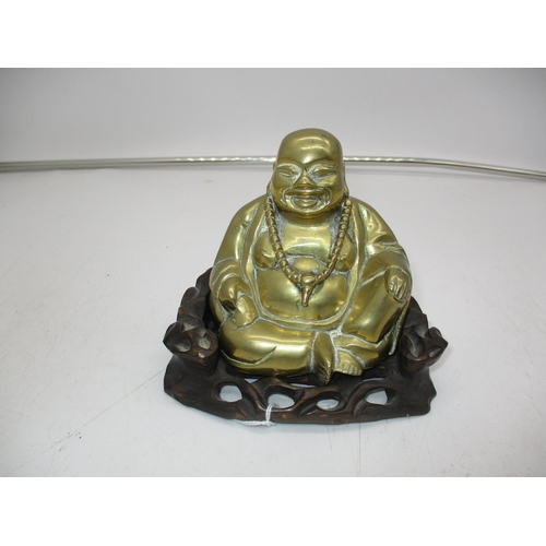 319 - Brass Buddha on a Wooden Stand, 13cm