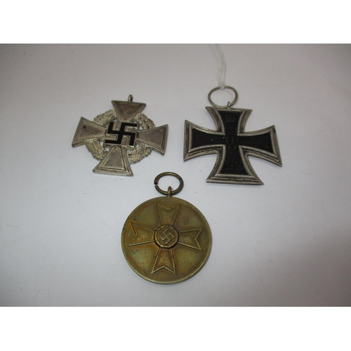 394 - 1914 German Cross, German Faithfull Service Medal and a German War Merit Medal 1939