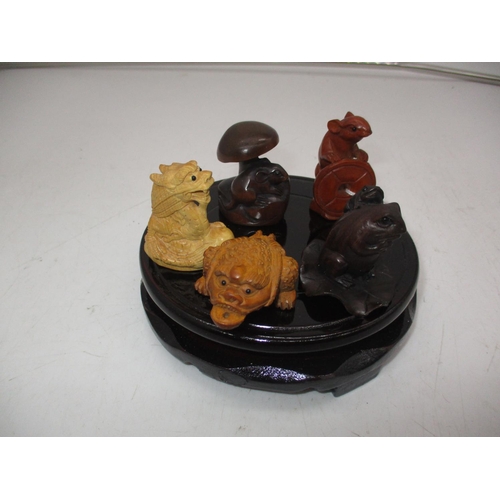 441 - Four Chinese Carved Wood Netsukes, Carved Beast and a Wooden Stand