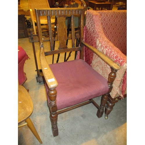 586 - 1920's Oak Elbow Chair