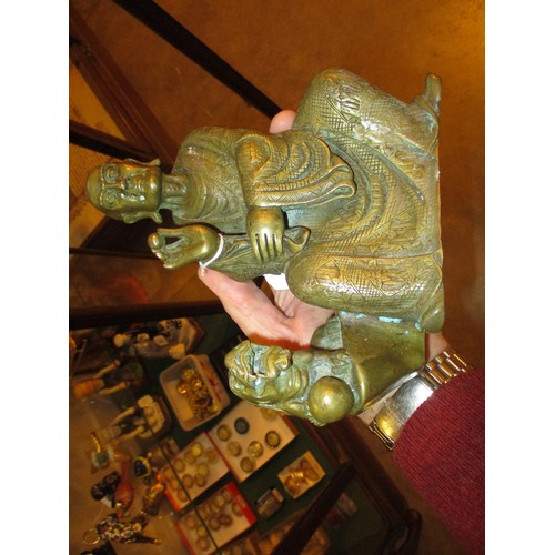 439 - Chinese Engraved Brass Deity with Temple Lion, 20cm