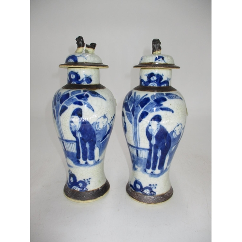 Pair of Chinese Porcelain Crackle Glaze Lidded Vases Painted with Figures and Scenes, 26cm