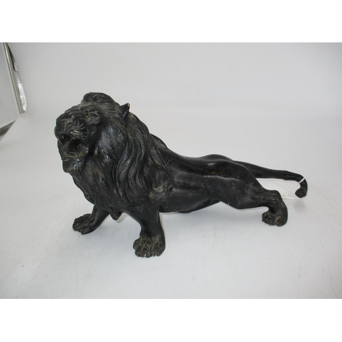 360 - Patinated Spelter Figure of a Lion, 34cm long