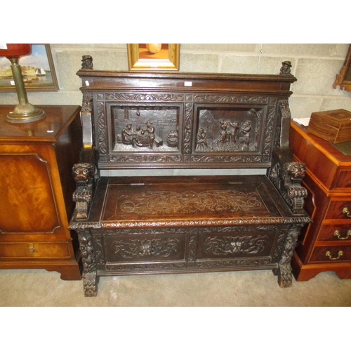 758 - Victorian Ornately Carved Oak Box Seat Hall Settle, having Lion Carved Arms and the Back Panels Carv... 