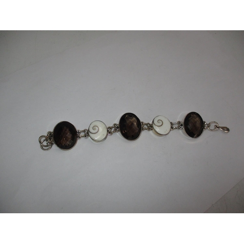 521 - Smoky Quartz and Shiva Eye Shell Bracelet