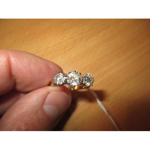 392 - Three Stone Diamond Ring, the stones of approx 6mm and 5mm