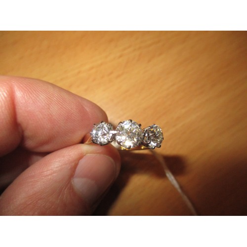 392 - Three Stone Diamond Ring, the stones of approx 6mm and 5mm