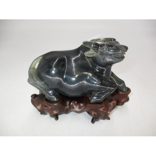 503 - Chinese Carved Buffalo on a Wooden Stand, 15cm long