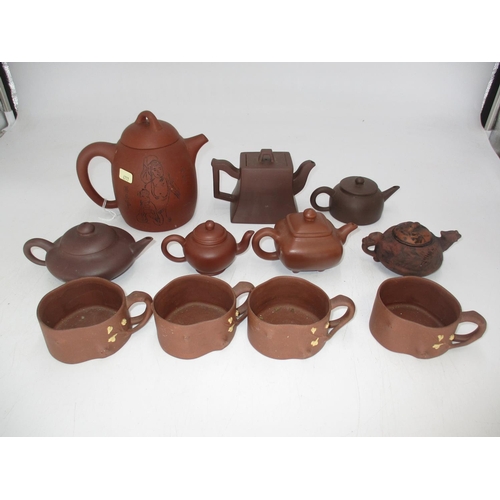 508 - Seven Chinese Terracotta Teapots and 4 Cups