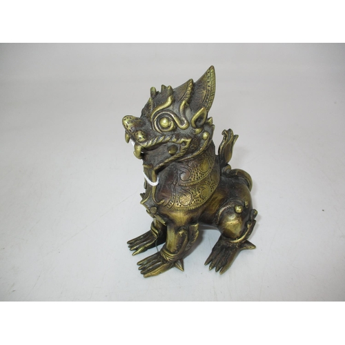 538 - Chinese Bronze Temple Lion, 13cm high