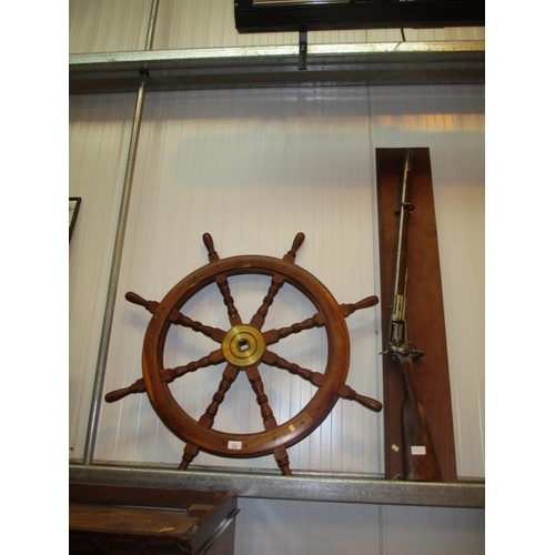 332 - Ornamental Rifle and Ship Wheel