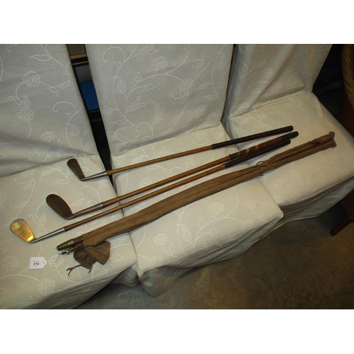 214 - Three Vintage Hickory Golf Clubs and a Cane Fishing Rod