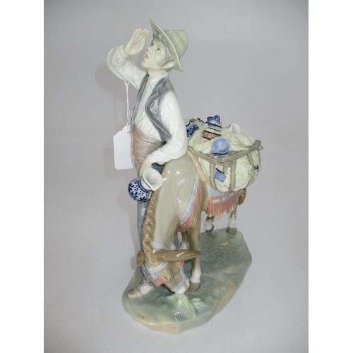 273 - Lladro Porcelain Peddler Group, 27cm