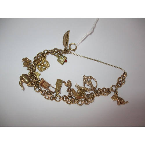 463 - 9ct Gold Charm Bracelet, 33.3g total