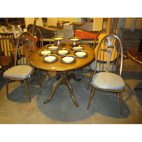 730 - Ercol Extending Dining Table with 4 Swan Back Chairs