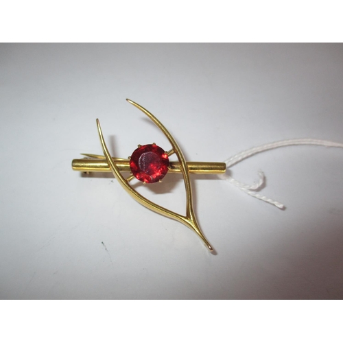 394 - 9ct Gold and Red Stone Wishbone Brooch, 8.2g