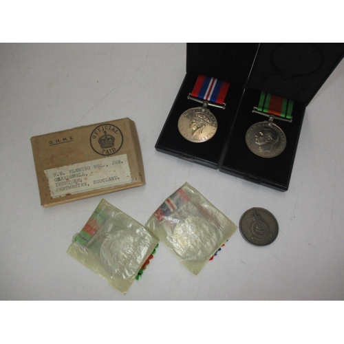 310 - Two WWII Medals in a Box Addressed to FM Fleming Esq Jnr Ghardswell Inchture Perthshire, along with ... 