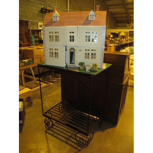 651 - Large Dolls House with Furnishings on a Metal Stand