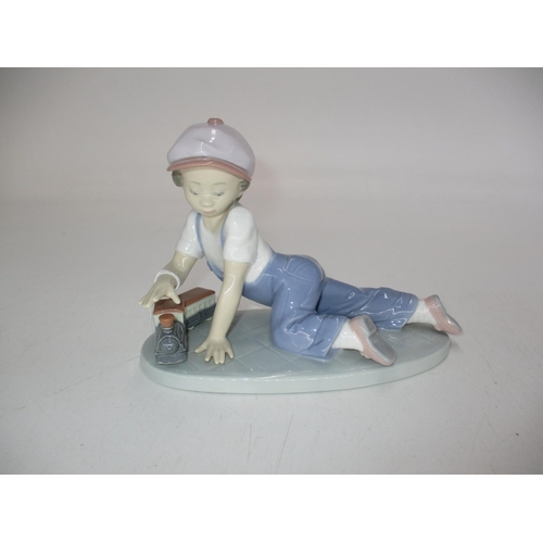 196 - Lladro Collectors Society Figure of a Boy with a Model Train, 7619