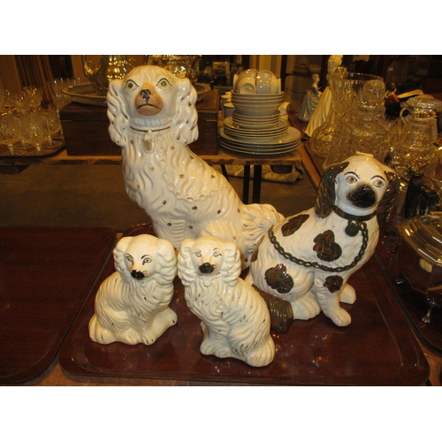 92 - Four Staffordshire Pottery Spaniels