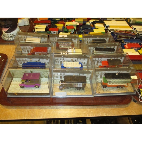 86 - Twelve Perspex Cased Vehicles