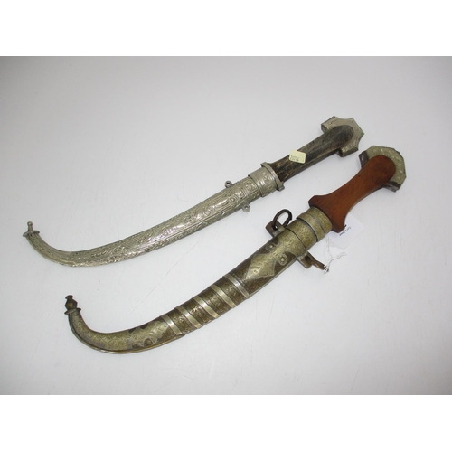 362 - Two Middle Eastern Curved Blade Daggers