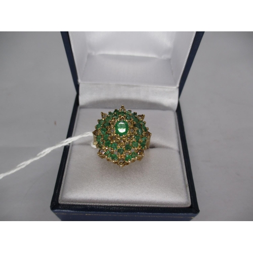 490 - 9ct Gold Emerald and Diamond Large Oval Cluster Ring