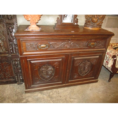 744 - Victorian Carved Oak Sideboard having a Secretaire Top Drawer, 135cm