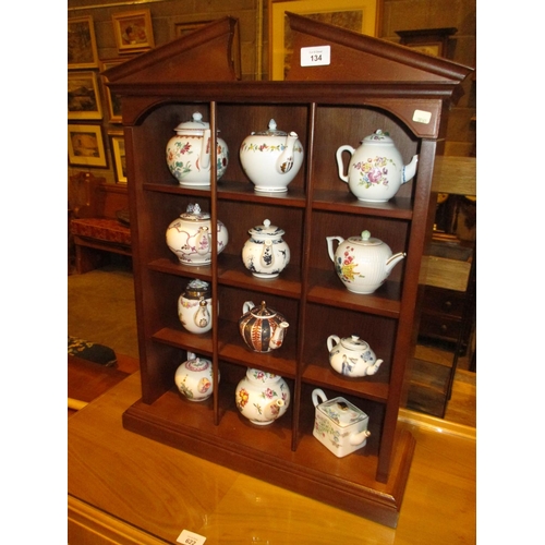 134 - Display Shelves with 12 Franklin Mint Victoria & Albert Museum Teapots