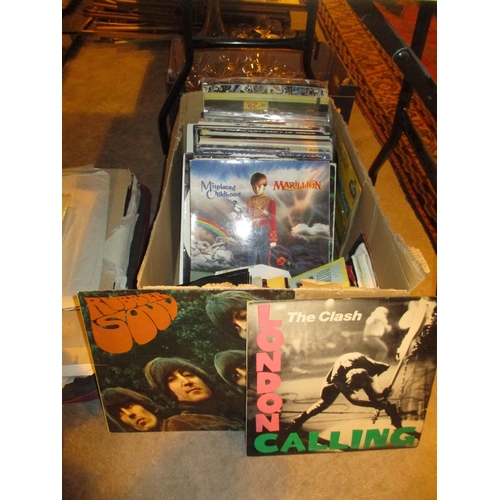 68 - Box of LPs and 45s including The Beatles, The Clash, Marillion