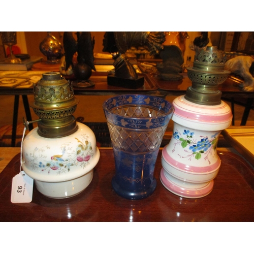 93 - Two Victorian Porcelain Oil Lamps and a Blue Overlaid Glass Vase