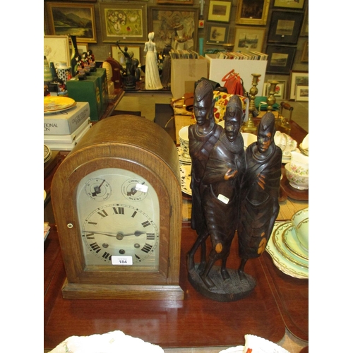 184 - Oak Mantel Clock and a Carved Wood African Figure Group