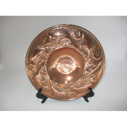 Arts & Crafts Copper Plaque Embossed and Chased with Fish around a Disked Centre, possibly by Eustace/Pool, 30cm