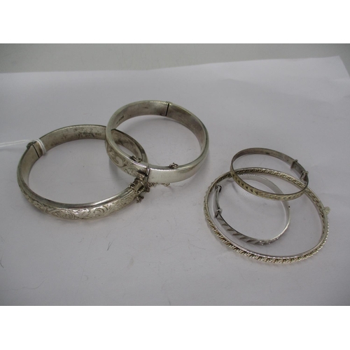 568 - Two Silver Hinged Bangles and 3 Others