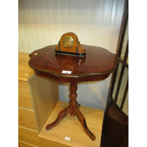 316 - A Small Clock and a Pedestal Table