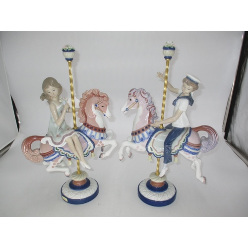 330 - Pair of Lladro Figures of a Boy and Girl on Carousel Horses Nos. 1469, 1470