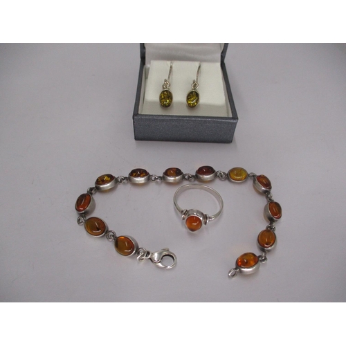 455 - Silver and Amber Bracelet, Ring and a Pair of Earrings