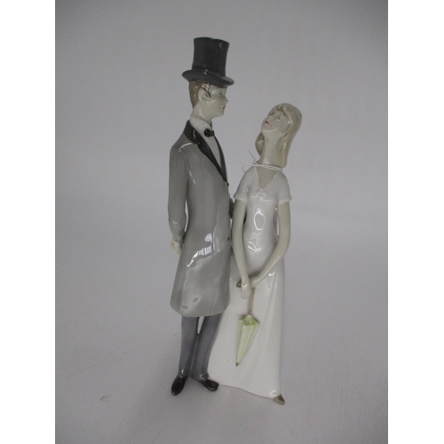 519 - GDR Porcelain Figure of a Bride and Groom, 28cm