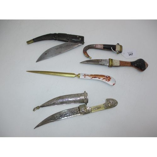 347 - Two Middle Eastern Sheathed Daggers and a Folding Knife, along with a Letter Knife