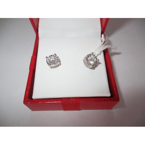 506 - Pair of 14K White Gold and Diamond Earrings, total diamond weight 1.250 cts