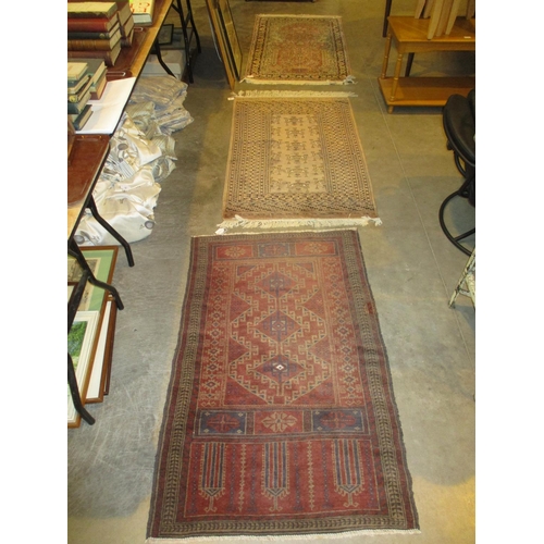 546 - Three Eastern Rugs, 134x84cm, 129x82cm and 130x80cm