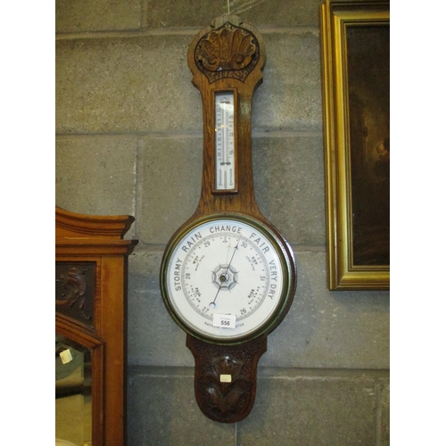 556 - Carved Oak Case Aneroid Barometer