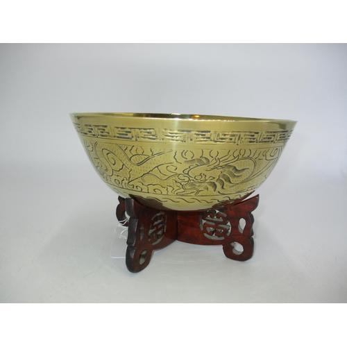 285 - Chinese Brass Ringing Bowl on Wooden Stand, 23cm diameter