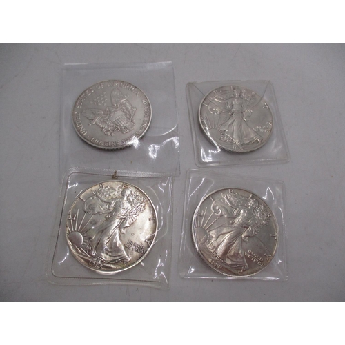 351 - Four US Silver Eagle 41 Coins, Each 1 Ounce 0.999 Silver , Dated 1988, 1989, 1990, 1993