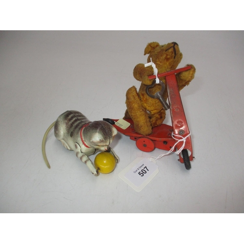 507 - German Tin Plate Clockwork Cat with Ball and a Clockwork Bear on a Scooter