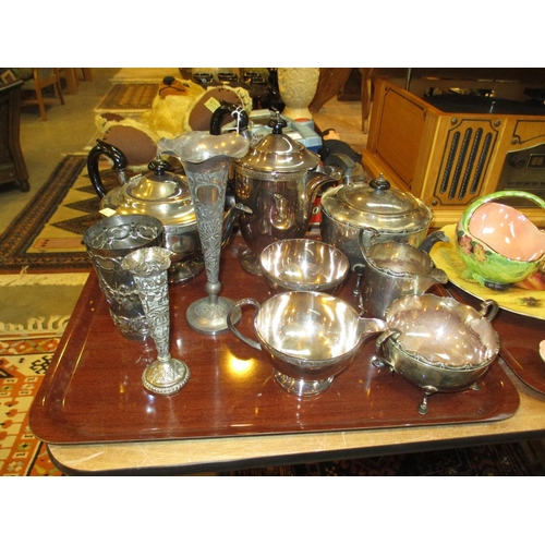 33 - Two Indian White Metal Vases and 2 Silver Plated Tea Services