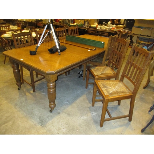 713 - Victorian Oak Extending Dining Table with 2 Leaves and Handle, along with a Set of 9 (1 arm and 8) G... 