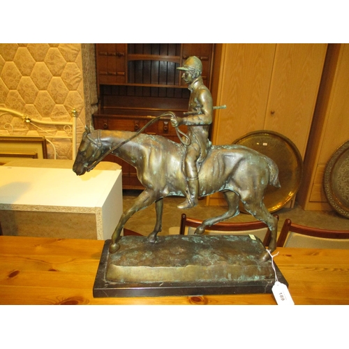 189 - Verdi Gris Finish Horse and Jockey Group on a Marble Base, 43cm high