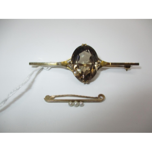 617 - 9ct Gold and Oval Faceted Citrine Brooch and a Small 9ct Gold and Seed Pearl Brooch (2)